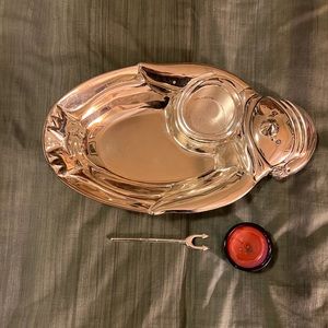 Vintage silver plate dip tray with candle in a penguin motif.